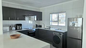 Apartment, Patio, Sea View | Private kitchen | Electric kettle