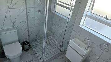 Apartment, Patio, Sea View | Bathroom | Bathrobes