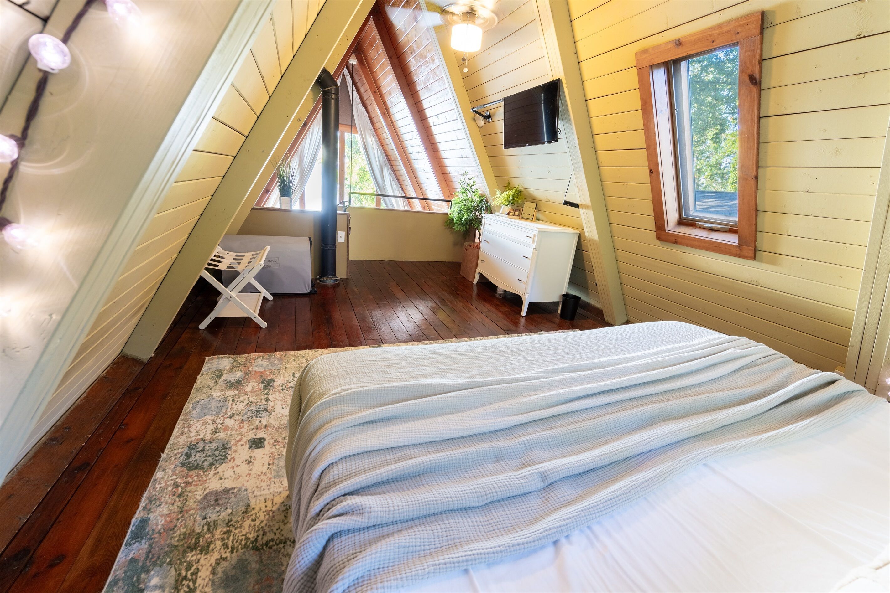Casper mattress, Nightstand USB ports and fun string lights make the loft bedroom a comfortable and fun place to lay your head at night.