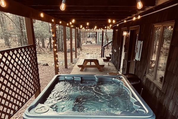 Hot Tub on the Ground Floor under the Deck and near the Picnic Table. Gotta Love the Warmth. Jump In!