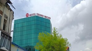A modern hotel building with a prominent sign reading 'HOTEL GRAND BAUAN.' - Grand Bagan Hotel (Butterworth)