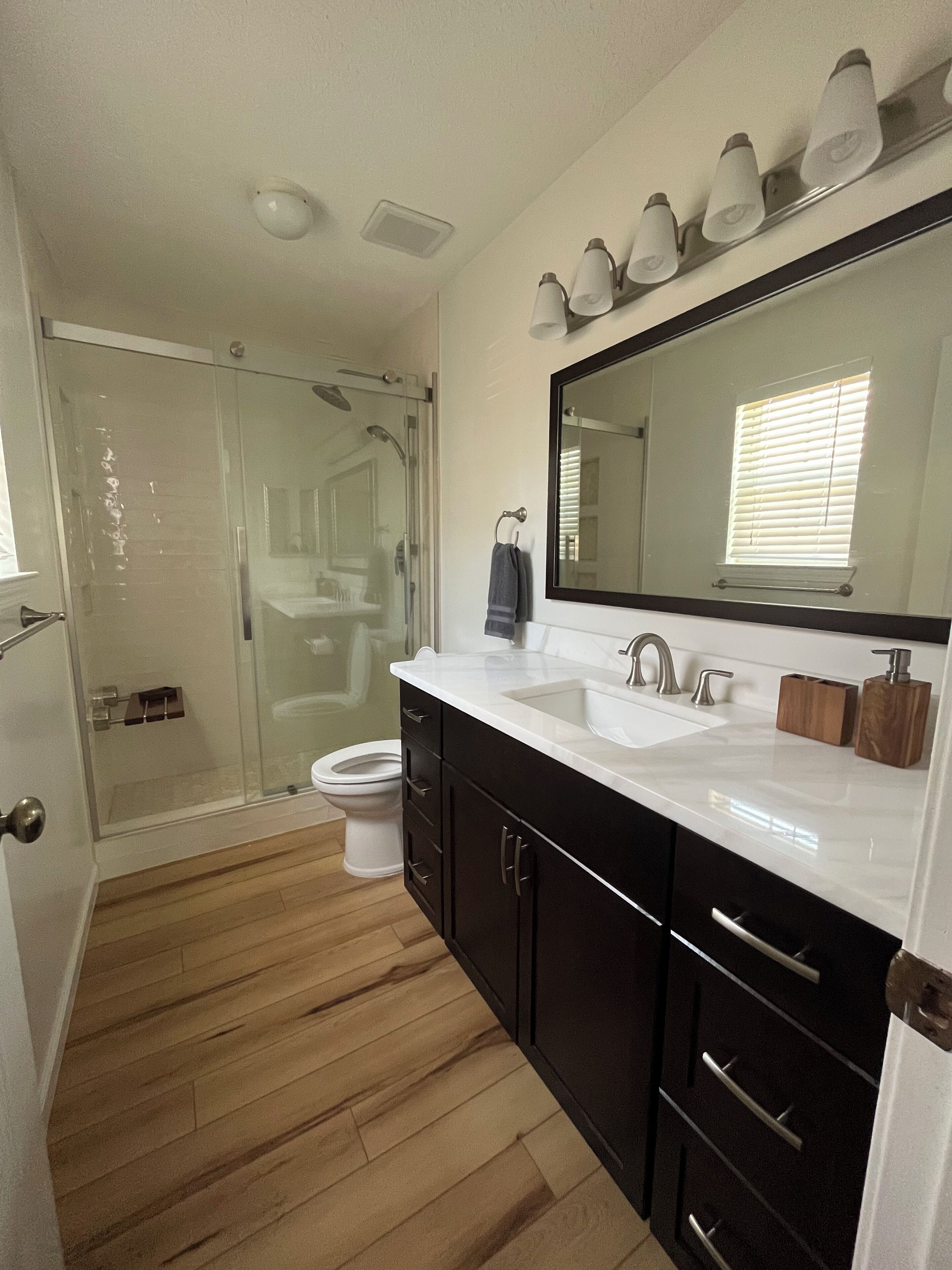 Shower, hair dryer, towels, toilet paper