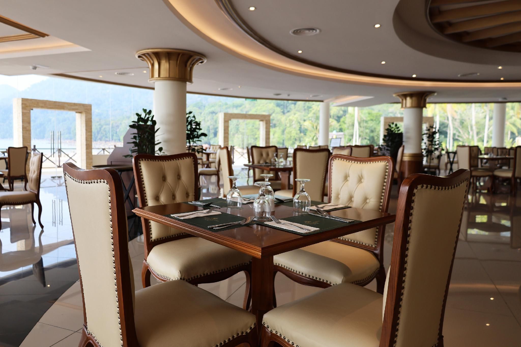A formal dining area with a large table, upholstered chairs, and a view of the outdoors.