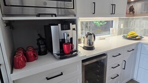 Coffee/tea maker, fridge, microwave, oven