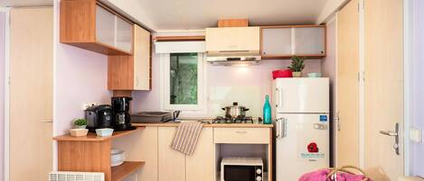 Fridge, microwave, electric kettle, cookware/dishes/utensils