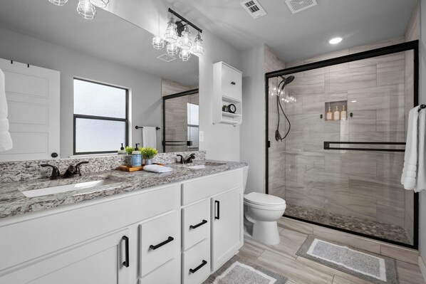 Shower, hair dryer, towels, soap