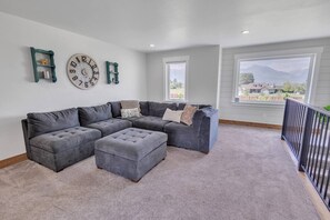 Smart TV, fireplace, books, computer monitors