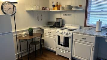 Microwave, stovetop, coffee/tea maker, cookware/dishes/utensils