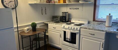 Microwave, stovetop, coffee/tea maker, cookware/dishes/utensils