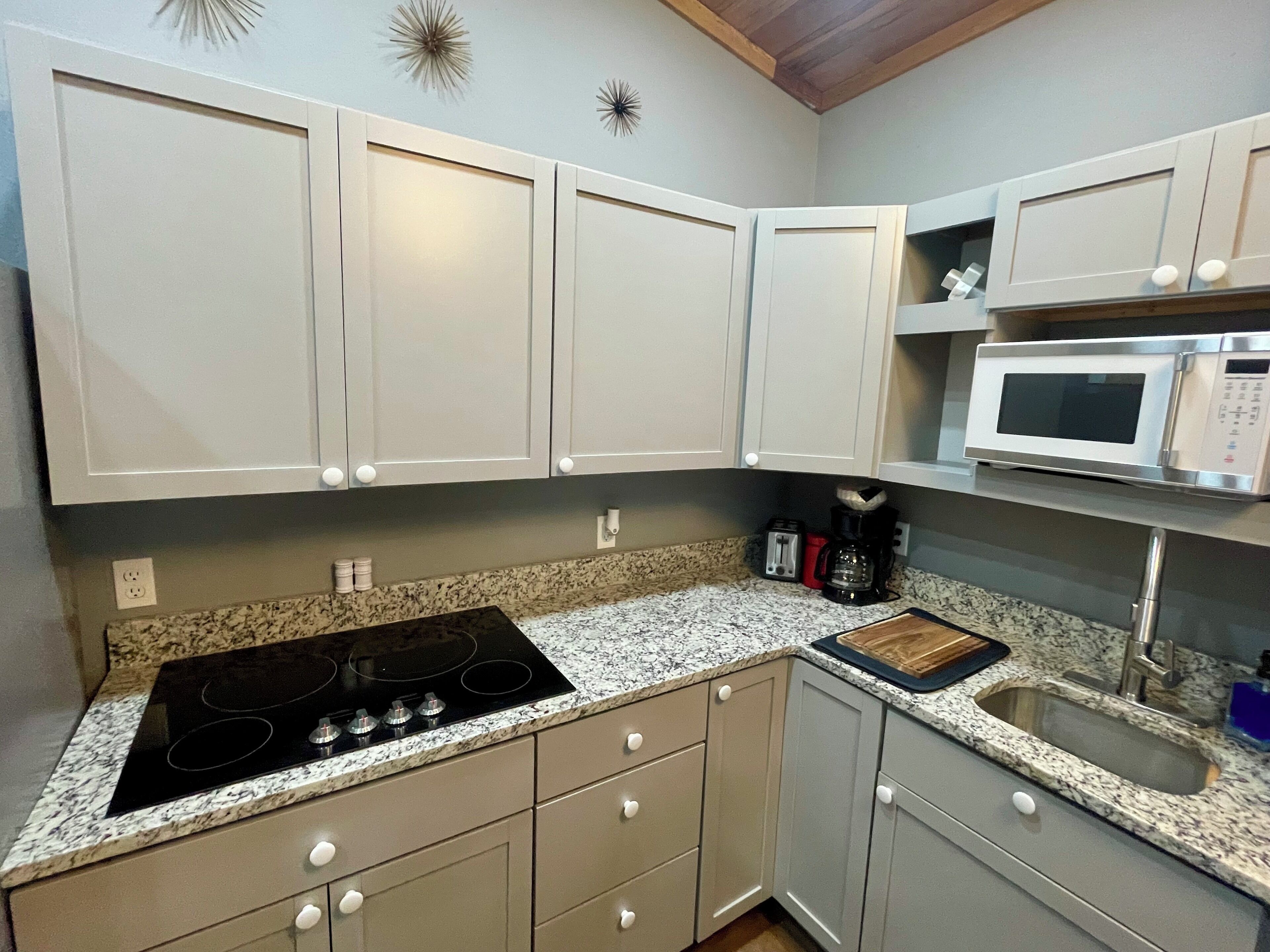 Fridge, microwave, stovetop, coffee/tea maker