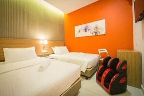 A hotel room with two beds, a massage chair, a wall-mounted lamp, and an orange accent wall. - Sovotel Boutique Hotel @ Puchong (Puchong)