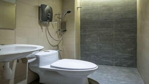 A bathroom with a toilet, sink, and shower. - Sovotel Boutique Hotel @ Puchong (Puchong)