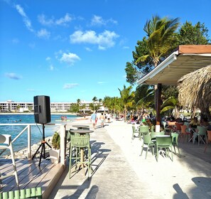 Outdoor dining - WELCOME TO A MAGICAL WORLD OF MOMENTS - BEACH APT, GOLF, POOL, RESORT ACCESS. (Punta Cana)