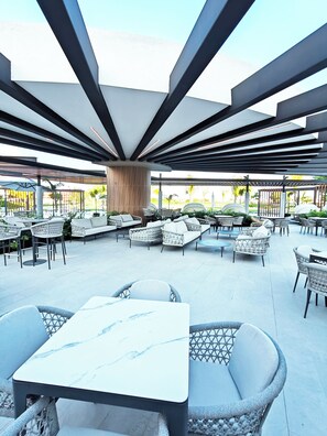 Outdoor dining - WELCOME TO A MAGICAL WORLD OF MOMENTS - BEACH APT, GOLF, POOL, RESORT ACCESS. (Punta Cana)
