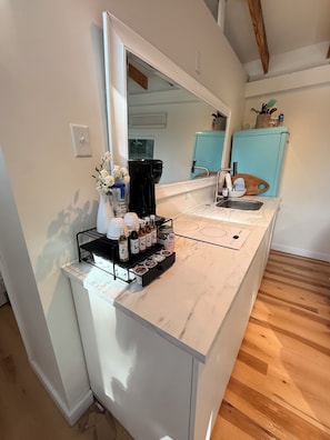 A kitchen with a marble countertop, a coffee maker, a sink, and a blue refrigerator. - Wooded Oasis.Free Bottle of Wine+Breakfast+Golf (Caseyville)