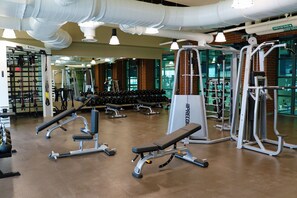 Work out in style with our well-equipped gym featuring exercise machines, benches, and weightlifting equipment.