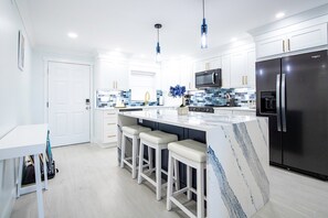 Fridge, microwave, oven, stovetop - Beachfront Beauty – Bright 2BR Condo w/ Heated Pool & Unbeatable Ocean Views! 🌊 (Cape Canaveral)