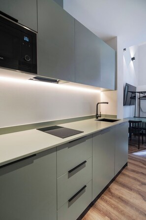 Fridge, microwave, stovetop, coffee/tea maker