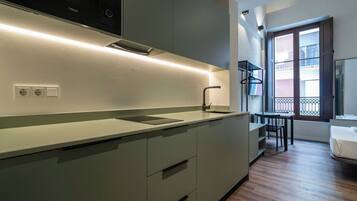 Fridge, microwave, stovetop, coffee/tea maker