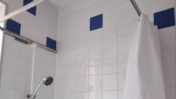 Shower, towels, toilet paper