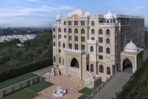 A large, multi-story building with a central courtyard, arched entrances, and a prominent dome on the top. - Welcomhotel By ITC Hotels Jabalpur (Jabalpur)