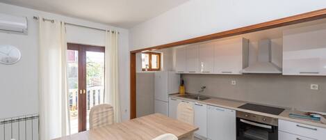 Apartment (Three Bedroom Apartment with Terrace) | Private kitchen | Fridge