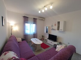 Apartment (Two Bedroom Apartment) | Living room | 32-inch flat-screen TV with cable channels