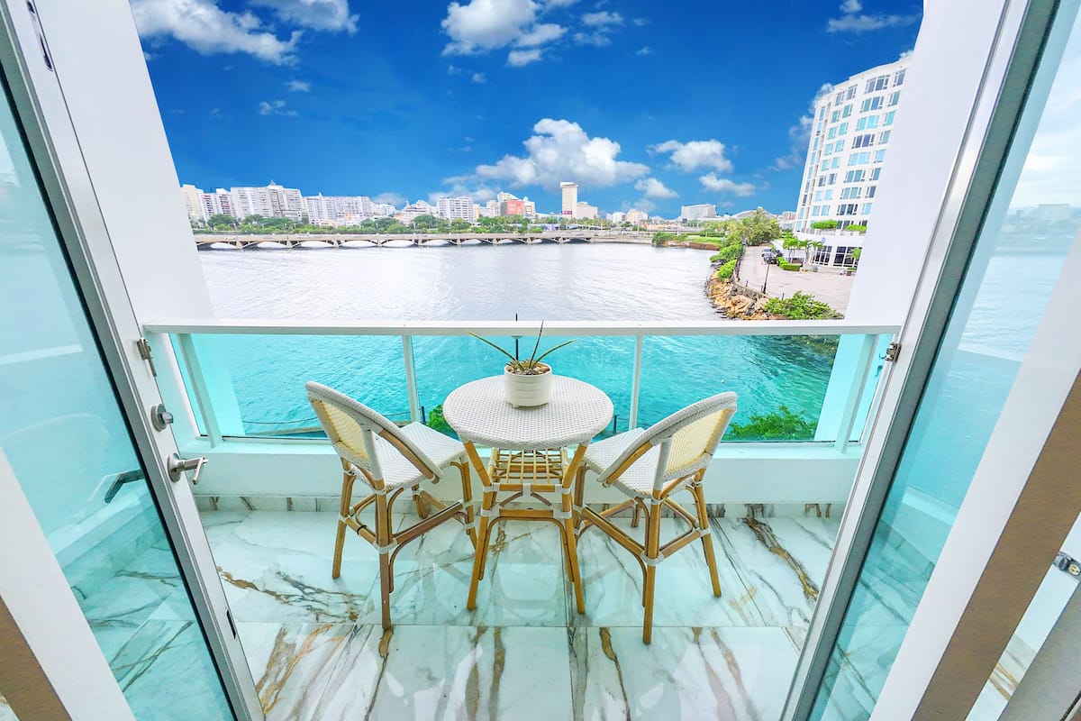 Economy Studio, Balcony, Lagoon View | Desk, laptop workspace, blackout curtains, iron/ironing board