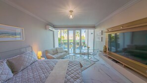 Exclusive Studio Suite, Balcony, Lagoon View | Desk, laptop workspace, blackout curtains, iron/ironing board - Condado Lagoon Villas (San Juan)