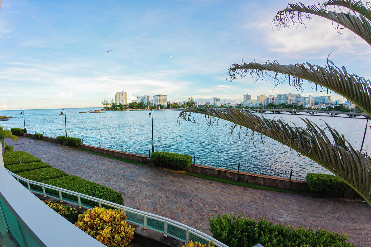 Economy Studio, Balcony, Lagoon View | Desk, laptop workspace, blackout curtains, iron/ironing board