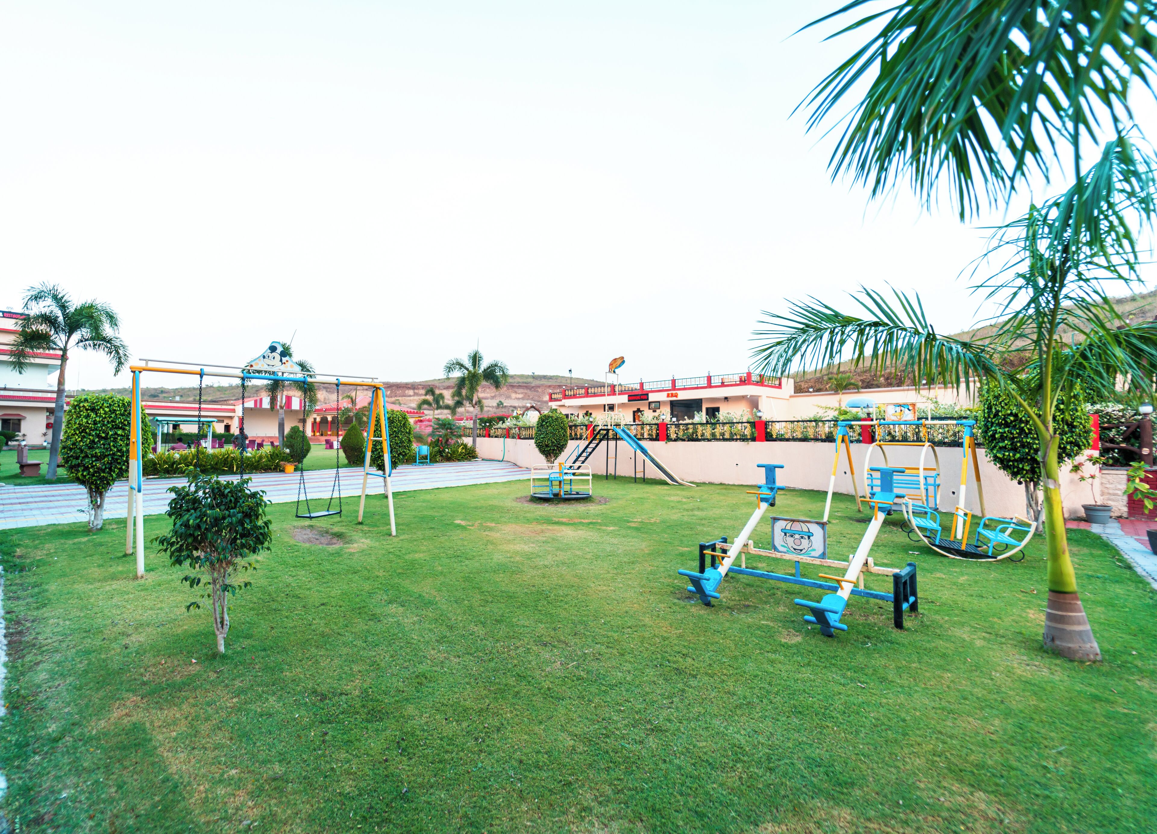A playground with swings, slides, and climbing structures.