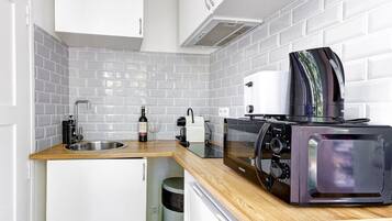 Fridge, microwave, coffee/tea maker, toaster