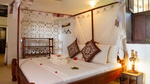 Unclassified image, 4 of 13, button - Cardamon Quadruple Family Suite Seaview with fans (Jambiani)
