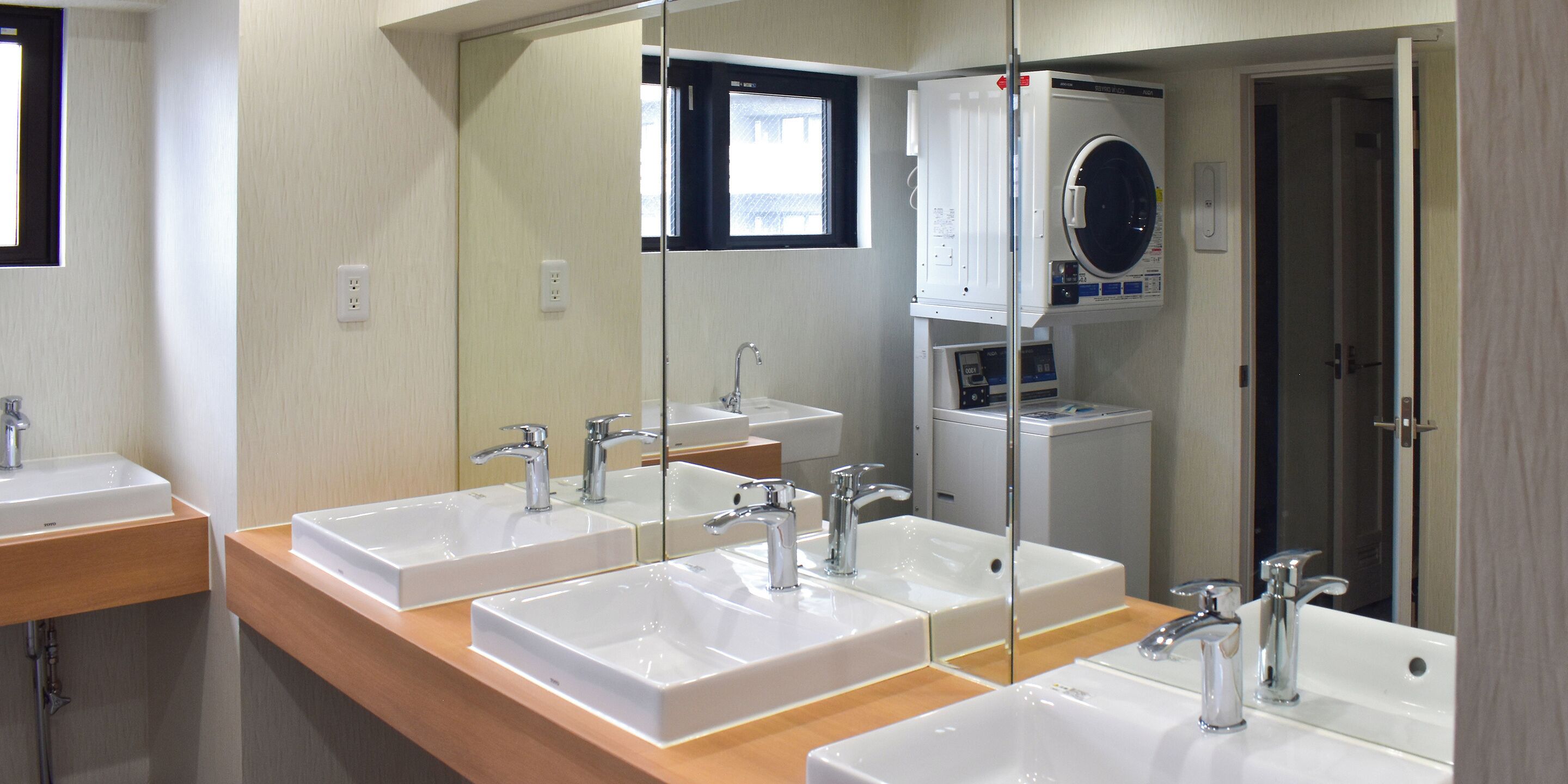 Shower, hair dryer, slippers, towels