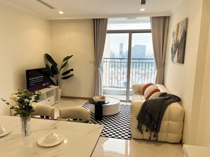 Luxury Apartment, 2 Bedrooms, Balcony, Park View | Living area | 80-inch LCD TV with cable channels