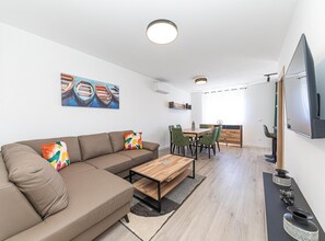 Apartment (Two Bedroom Apartment with Sea View a) | Living room | 32-inch flat-screen TV with digital channels
