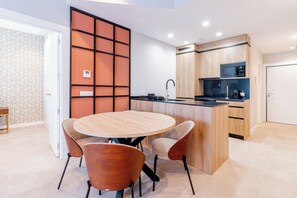 Business Apartment | Living area | 60-inch Smart TV with cable channels - Home Art Apartments Bernabéu (Madrid)
