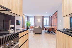 Presidential Apartment | Living area | 60-inch Smart TV with cable channels - Home Art Apartments Bernabéu (Madrid)
