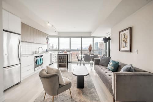 Deluxe Condo, 2 Bedrooms, Balcony, City View | Living area | 42-inch flat-screen TV with satellite channels, Netflix, Hulu