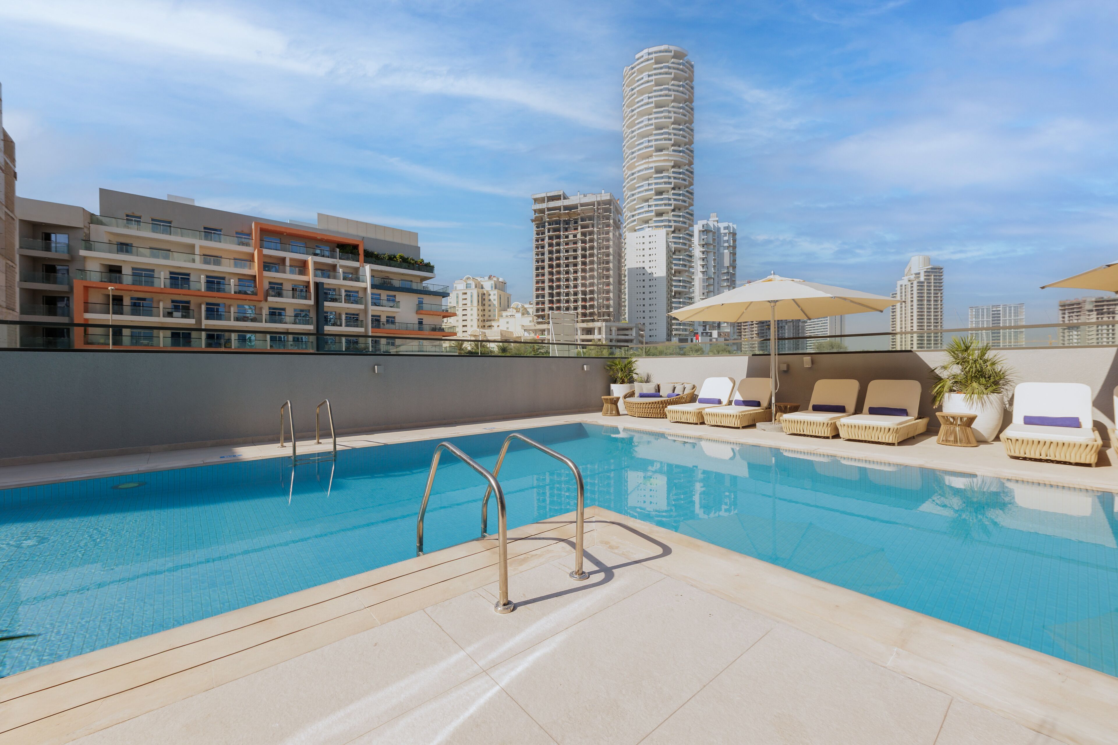 Outdoor pool, open 7:00 AM to 9:00 PM, pool umbrellas, pool loungers