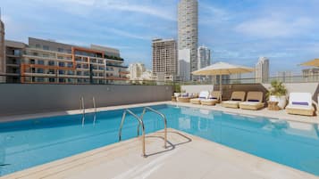 Outdoor pool, open 7:00 AM to 9:00 PM, pool umbrellas, pool loungers