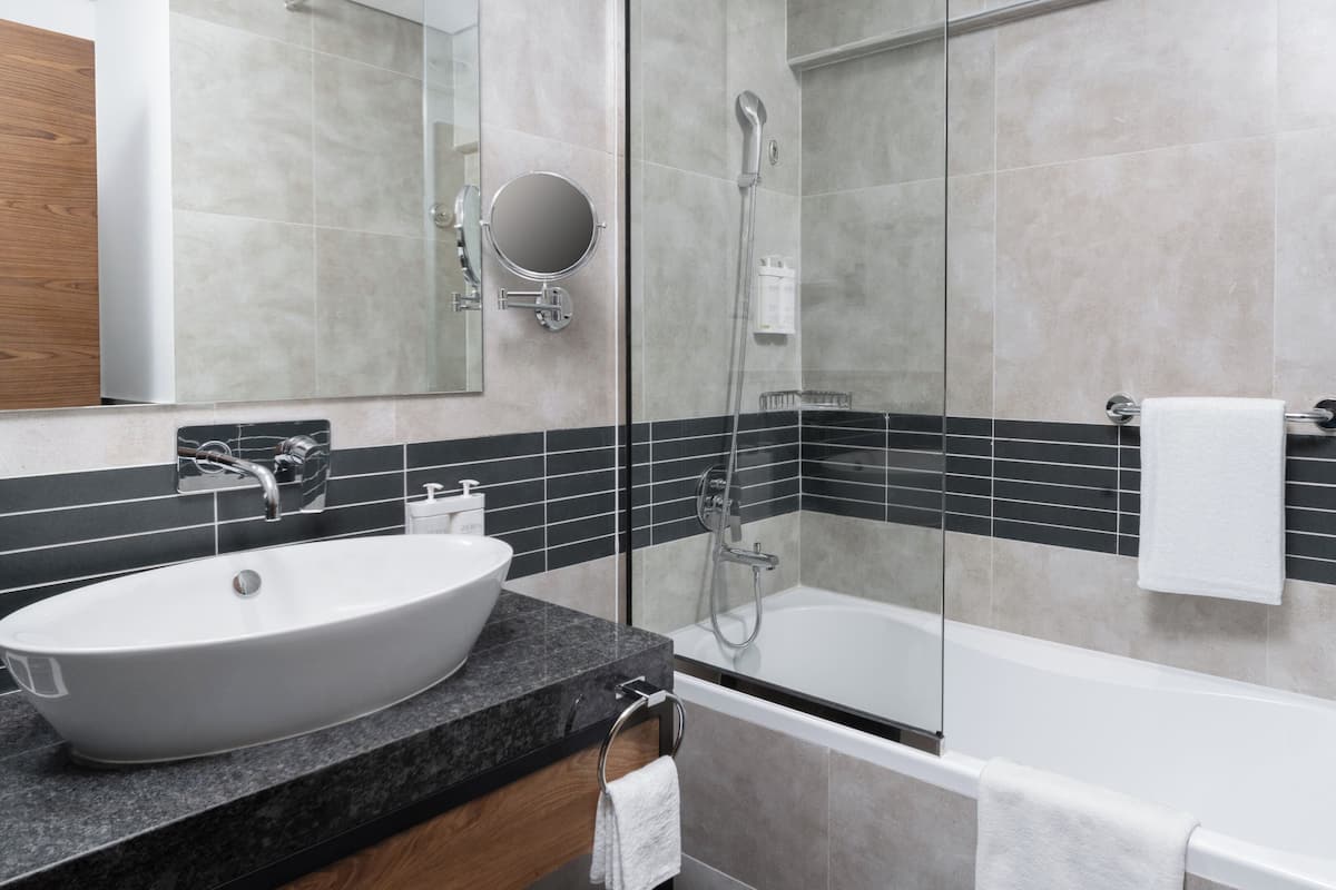 Bathrobes, slippers, bidet, towels