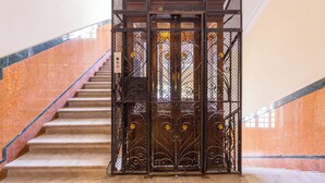 A staircase with a metal gate at the top. - Santa Lucia Seaview (Naples)