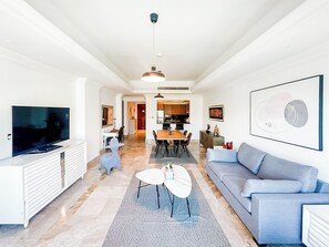 Deluxe Apartment, 1 Bedroom, City View | Living area | 55-inch Smart TV with cable channels - 1BR North Residence with Beach Access (Dubai)