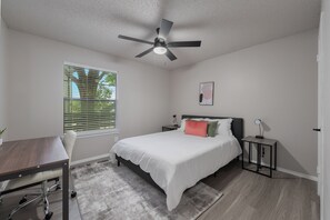 1 bedroom, desk, iron/ironing board, travel crib