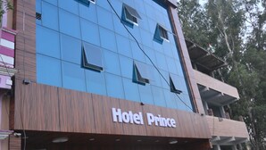 A hotel named "Hotel Prince" with a modern facade, large windows, and a prominent entrance. - Hotel Prince (Gorakhpur)
