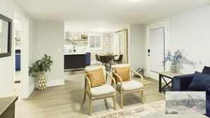 A spacious living room with a dining area, a kitchen in the background, and a large window with curtains. - NEW OSU Reser Stadium Glamour- KING BEDS (Corvallis)