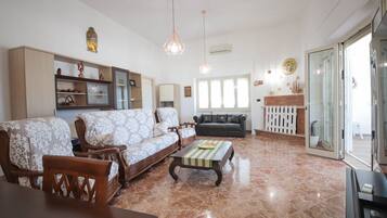Villa, Sea View | Living area | 32-inch flat-screen TV with satellite channels
