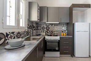 Chambre Triple Familiale, balcon | Cuisine privée