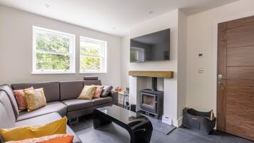 Deluxe Cottage | Living area | 40-inch LED TV with digital channels, Netflix, streaming services